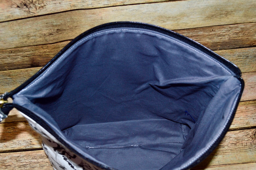 The Vogue Cosmetic Bag – Black & White French Script with Blue Lining